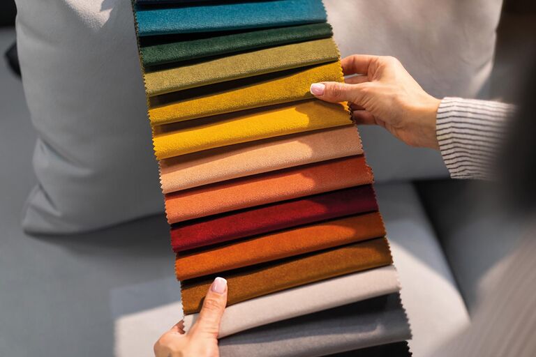 woman-chooses-fabric-sofa-young-women-looks-tissue-samples